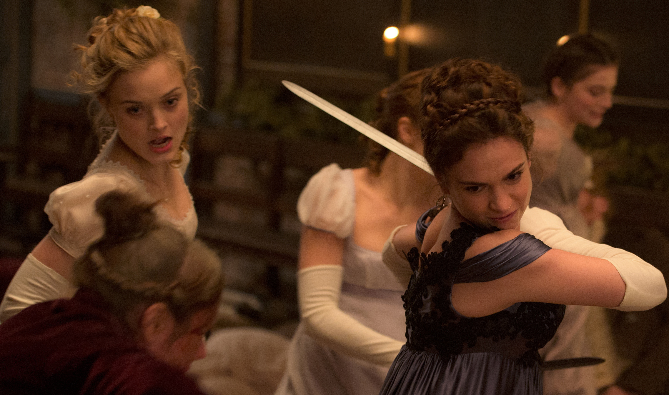(l-r) Lily James and Bella Heathcote in Screen Gems' PRIDE AND PREJUDICE AND ZOMBIES. ©CTMG. CR: Jay Maidment.