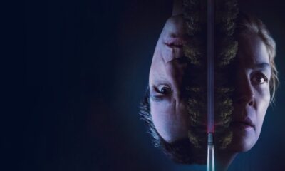Upside-down double-exposure of a man and woman with a forest overlay and a vertical pink light between them.