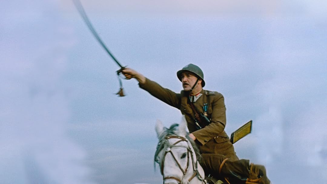 Soldier in a brown uniform riding a white horse, swinging a saber against a pale blue sky.