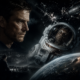 Close-up profile of a determined man beside a cracked astronaut helmet in a space disaster scene, with debris and Earth in the background.