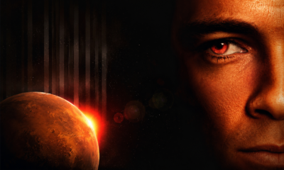 Sci-fi image: close-up of a man's face on the right with a red eye, Mars at left with a bright sun glow in space backdrop.
