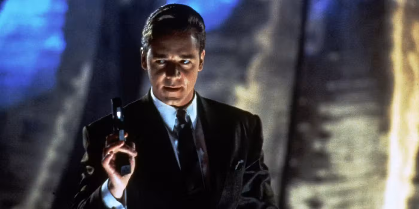 Man in a dark suit holding a pistol, looking intently ahead in a moody, neon-lit scene.