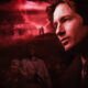 Man's profile dominates the right side, with a red-tinted, stormy montage of a house, a couple embracing, and anxious onlookers in the foreground.