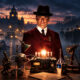 A man in a burgundy suit and fedora stands behind a steampunk workbench with lamps and gadgets on a cobblestone street at dusk, fog in the background.